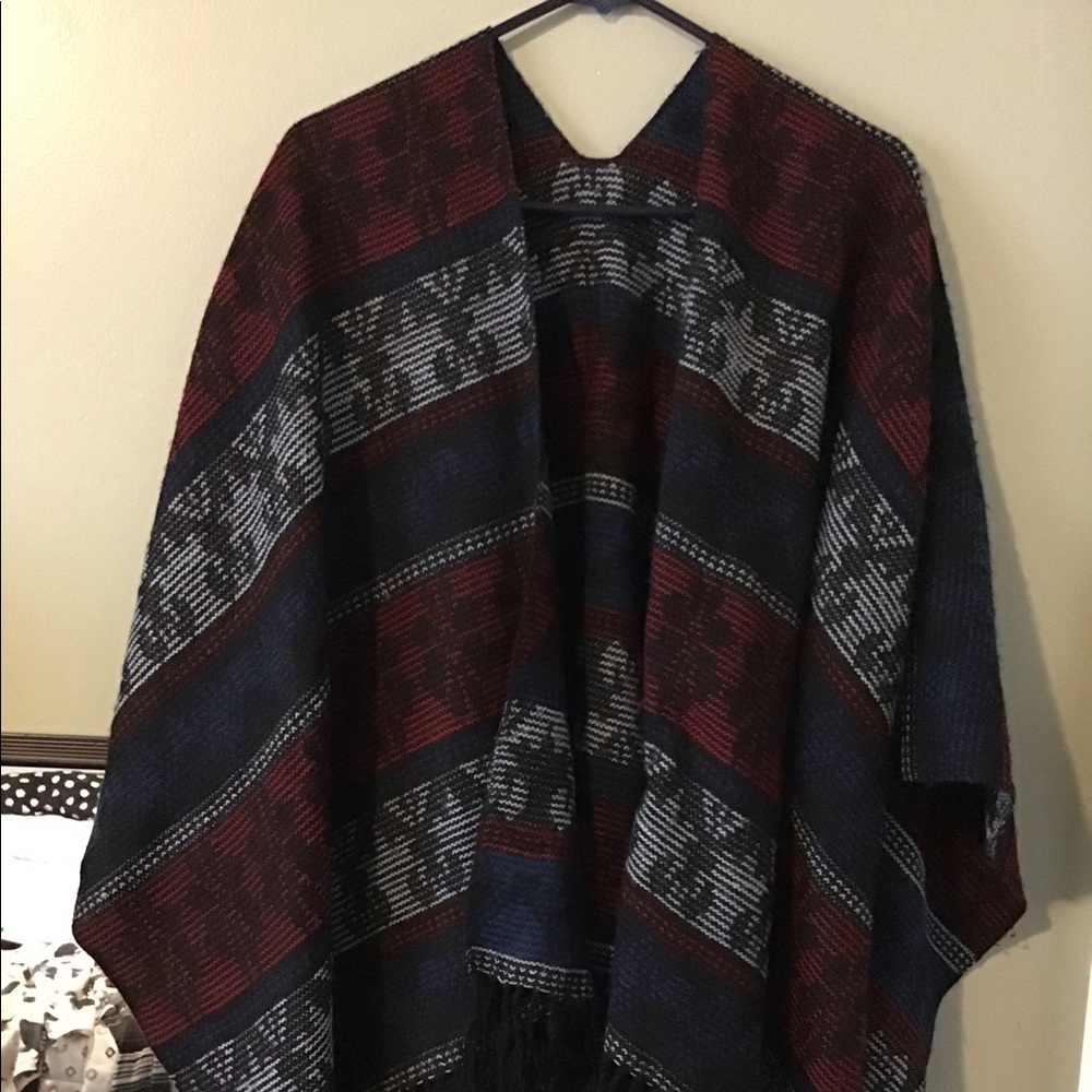 Beautiful shawl with fringes on bottom hem line.